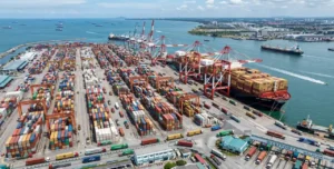 High-volume maritime export freight and container shipping operations at Port Klang terminal in Malaysia