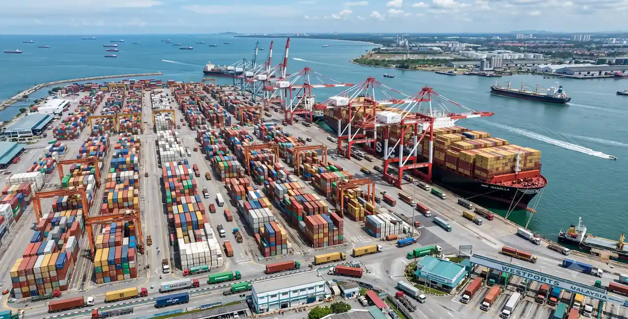 High-volume maritime export freight and container shipping operations at Port Klang terminal in Malaysia